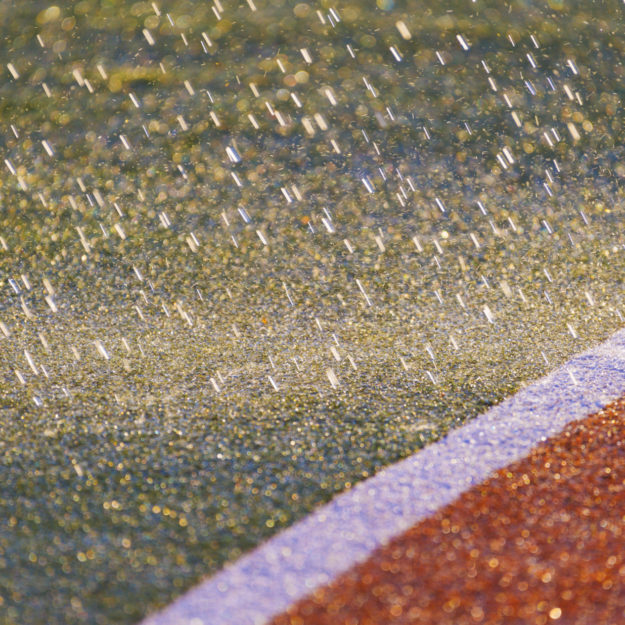 It rains .Texture of the herb cover sports field. Used in tennis, golf, baseball, field hockey, football, cricket, rugby.